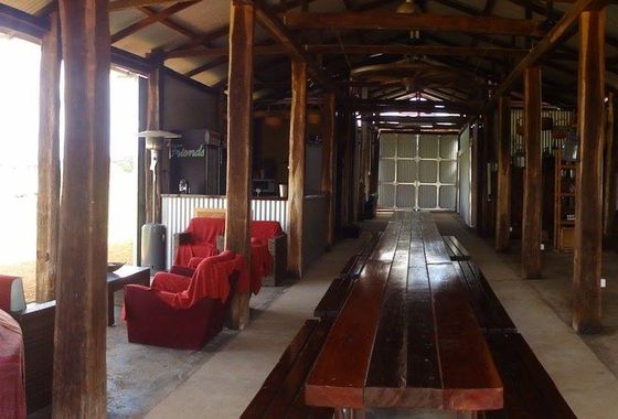 The solid jarrah 10-metre table and benches running down the centre of the shed.